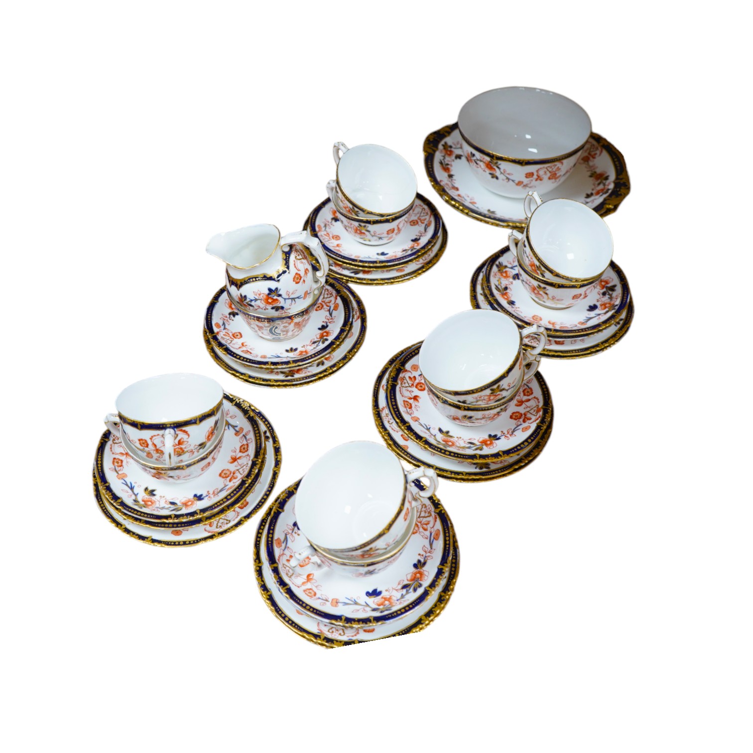 A Royal Crown Derby Imari porcelain part tea set to include sandwich plates, trios and milk jug. Condition - varies, some breaks